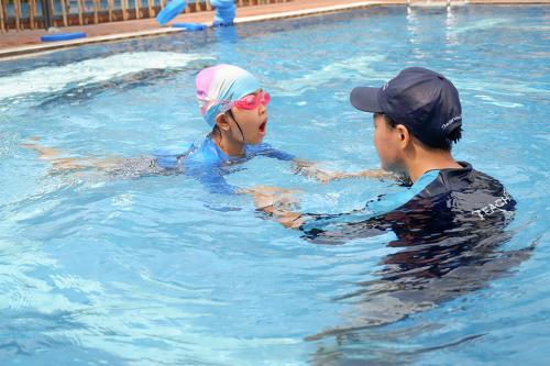 Swimming lesson at the school